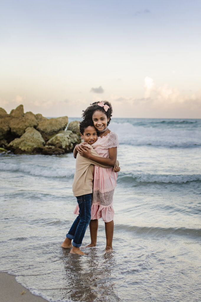 siblings at the beach